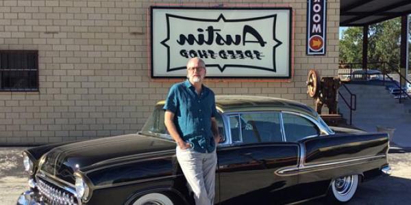 Neurosurgeon Dan Peterson displays his CU-themed black and gold 1955 Chevy outside of Austin Speed Shop.