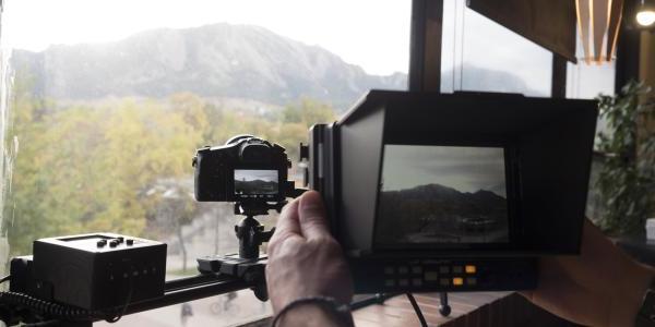 Photo of cameras aimed at cameras aimed at the mountains.