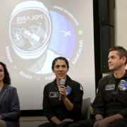 CU Boulder aerospace engineers Torin Clark, left, and Allie Hayman, right, 2022年，在博彩app推荐期间，与北极星黎明号的工作人员坐在一起.