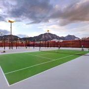 Photo of students playing on the rooftop tennis courts.