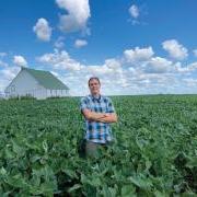 Brian DeDecker in a soybean field at his family farm in Illinois.