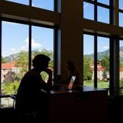 Silhouette of a student studying on campus