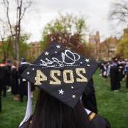 A decorated graduation cap during commencement ceremony