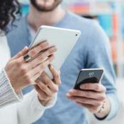 two people looking at devices